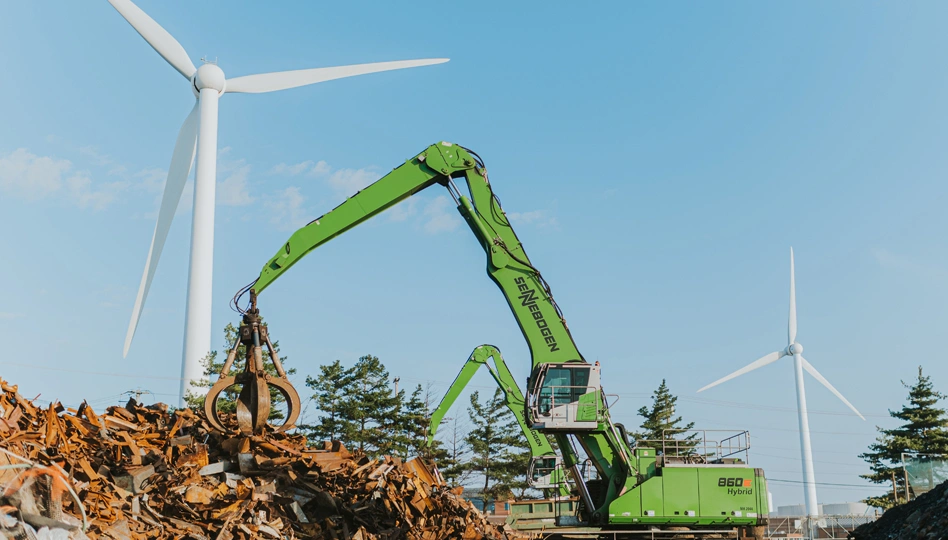 Radius Recycling Scrap Processing Operations Scrap metal crane loading material near wind turbines