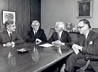 Schnitzer executives meeting in corporate boardroom