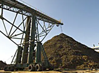 Conveyor system moving bulk scrap metal