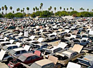 Large auto salvage yard with recycled vehicles