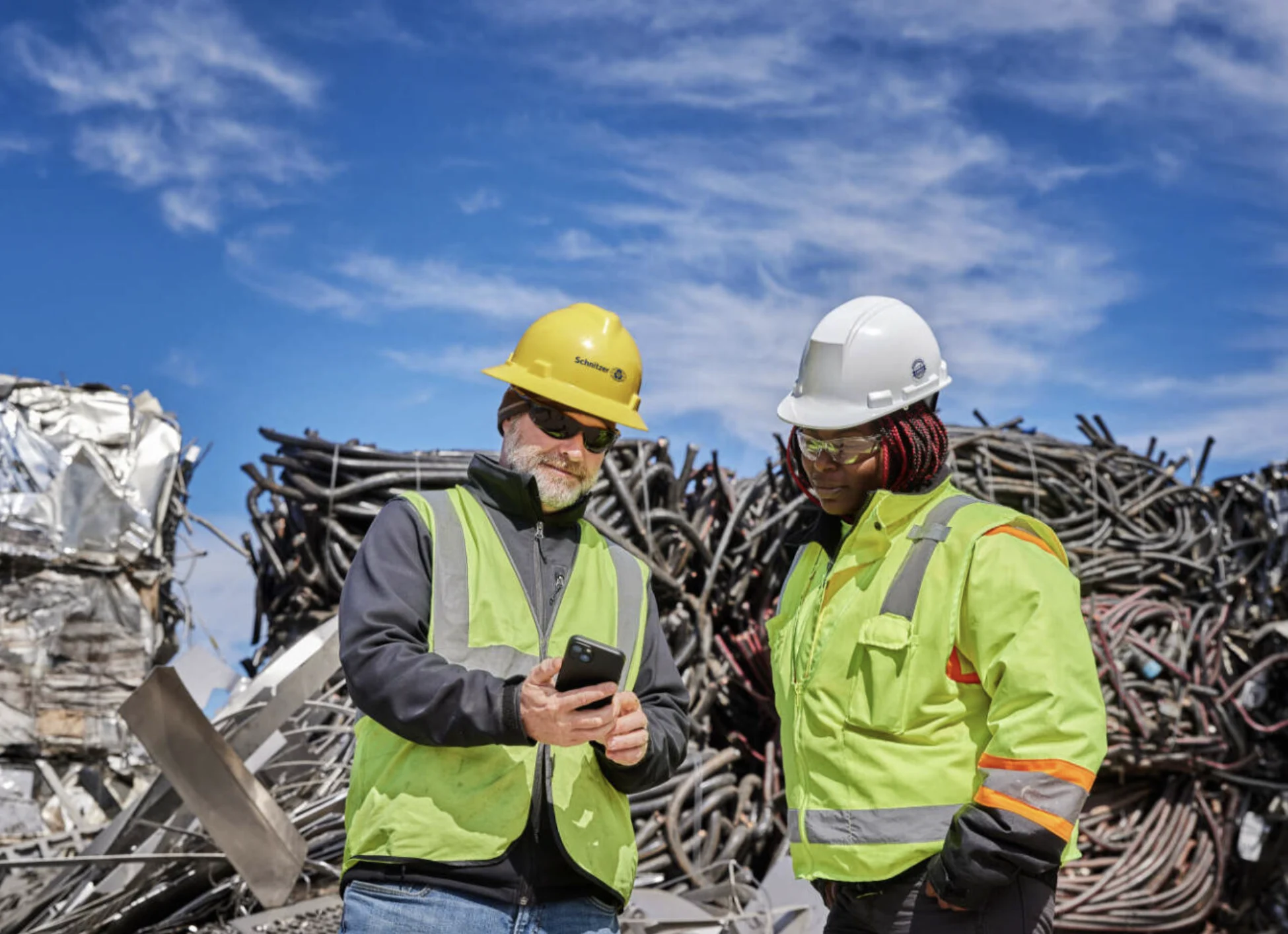 Metal recyclers working at the scrap yard