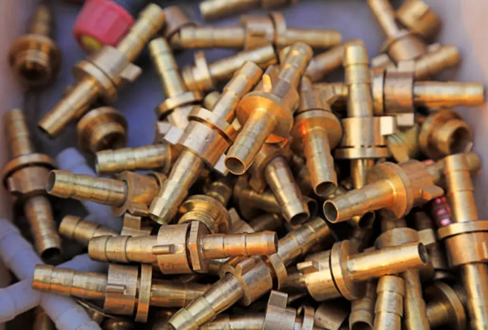 Brass scrap metal fittings and valves collected for recycling