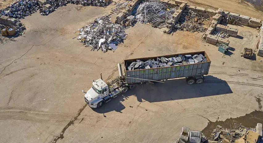 truck hauling light iron scrap to a metal recycling facility