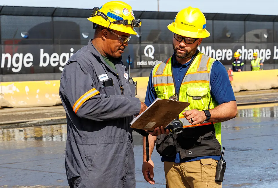 Radius Recycling team reviewing scrap metal purchase details
